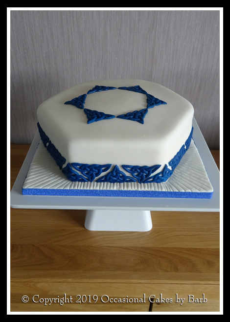 Single tier hexagonal cake with blue celtic knots